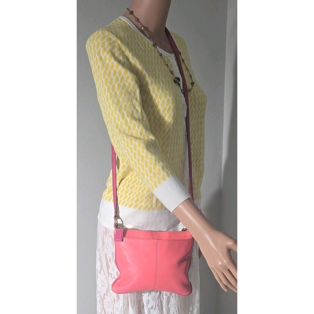 Coach Pink Crossbody Bag with Gold Hardware, Adjustable Strap, and Zip Closure